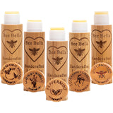 Bee Bella Lip Balm Collection of pomegranate, lavender, peppermint, cherry, and unflavored in a v-formation with their caps off.