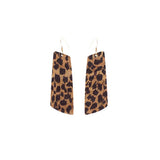 Vertical cheetah cork earrings against white background