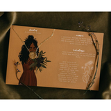 Informational card with illustrations and text about the attached necklace